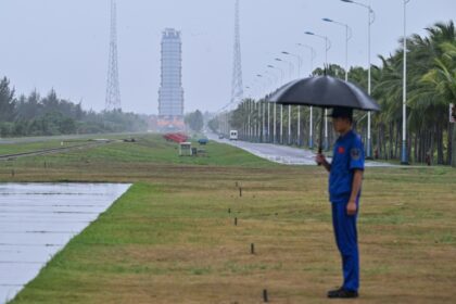 A guard stands watch near the launch platform for the Chang'e-6 lunar mission