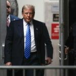 Donald Trump returns after a break during his criminal trial for allegedly covering up hush money payments