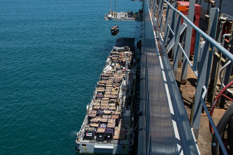 A picture released by the US military shows humanitarian aid being lifted onto a barge near the Israeli port of Ashdod