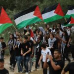 Arab-Israeli protesters wave Palestinian flags earlier this month as they commemorate the mass displacement that accompanied the establishment of the State of Israel in 1948