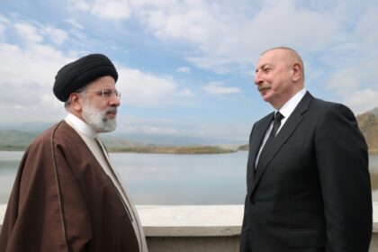 A handout picture provided by the Iranian presidency on May 19, 2024, shows Iran's President Ebrahim Raisi on the left and his Azeri counterpart Ilham Aliyev