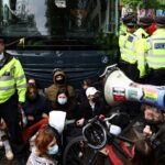 Police were called after the protesters tried to block a bus believed to be taking migrants from a hotel in south London
