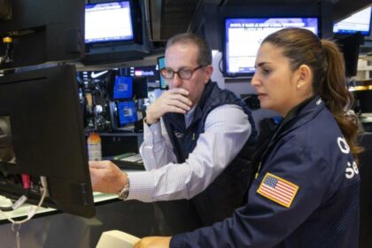 Wall Street slips on Federal Reserve policy caution