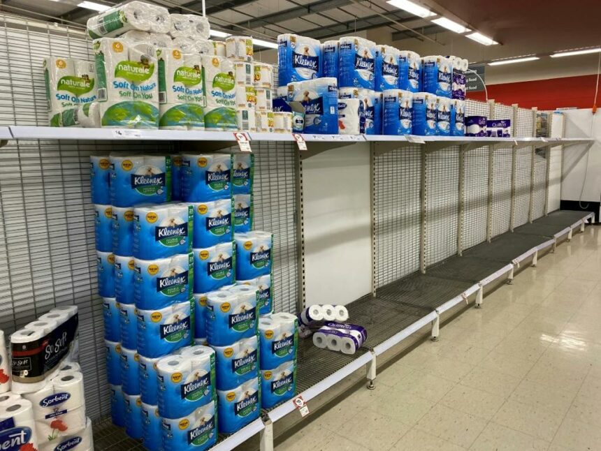 Near-empty shelves of toilet paper in a Melbourne supermarket