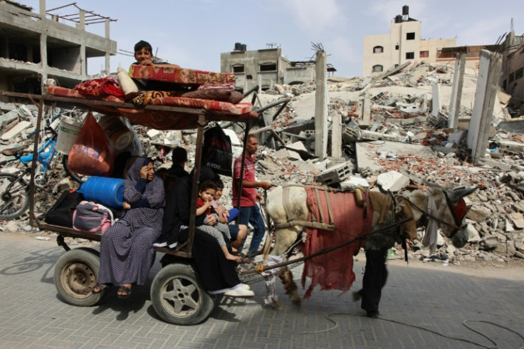 A Palestinian family flees with their belongings in the northern Gaza Strip