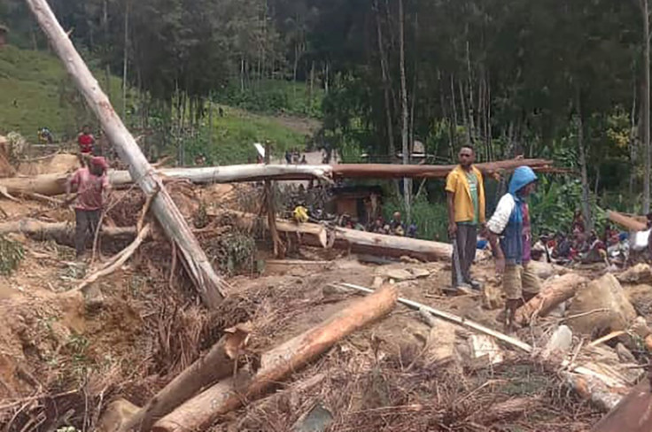 Papua New Guinea's government estimates that 2,000 people may be buried underneath a massive landslide that struck a thriving highland settlement in Enga province in the early hours of May 24