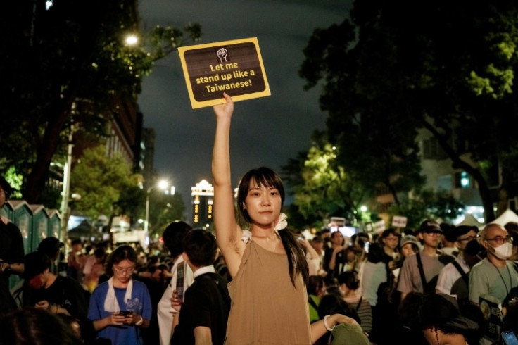 Tens of thousands of people took to the streets of Taipei to protest bills proposed by the opposition