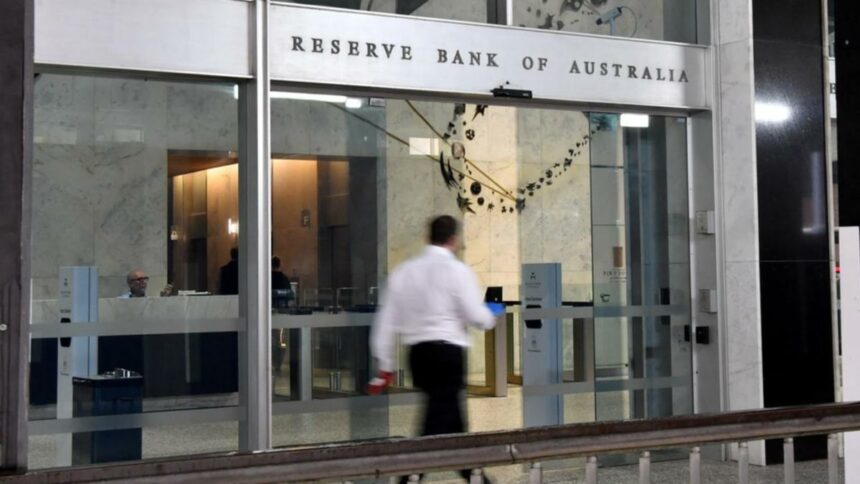 Aust shares edge lower at noon as RBA meeting kicks off