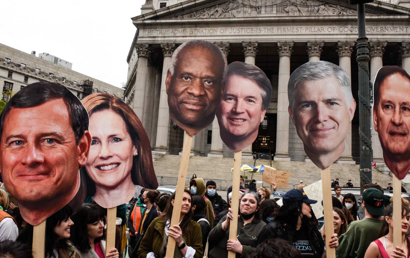 Demonstrators carry signs of the six conservative Supreme Court justices during a protest in New York in 2022.