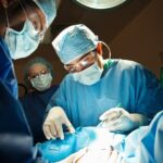 Surgeons performing C-Section in operating room