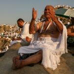 Muslim pilgrims pray at dawn on Saudi Arabia's Mount Arafat