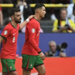 Bruno Fernandes and Cristiano Ronaldo celebrate together after the duo combined for Portugal's third goal in their 3-0 win over Turkey at Euro 2024