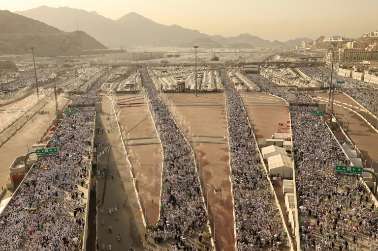 Muslim pilgrims arrive to perform the symbolic 'stoning of the devil' ritual as part of the hajj pilgrimage in Mina, near Saudi Arabia's holy city of Mecca, on June 16, 2024