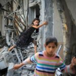 A Palestinian girl climbs over debris a day after an operation by the Israeli Special Forces in the Nuseirat camp, in the central Gaza Strip on June 9, 2024, amid the ongoing conflict between Israel and the Palestinian Hamas militant group.