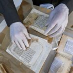 Said al-Barouni prepares to scan old manuscripts at his library