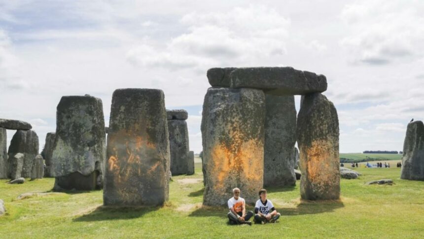 UK anti-oil and coal protesters spray paint Stonehenge