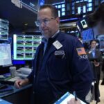 Wall Street mixed as rate-cut expectations rise