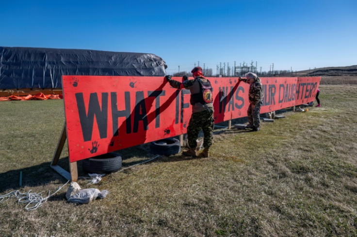A banner at the Prairie Green landfill demands empathy