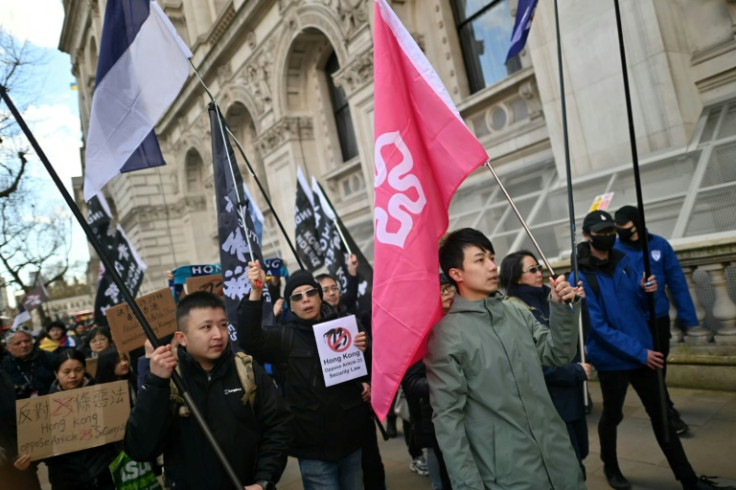 Finn Lau (centre right), pictured protesting in London in March 2024, said he has only ever held a British National Overseas passport