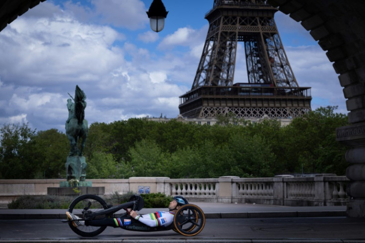France's paralympian cyclist Florian Jouanny poses at the Bir-Hakeim Bridge ahead of the Paris Olympics and Paralympics
