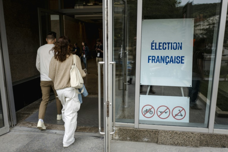 French nationals arrive to vote at the Centre Mont Royal during the first round of French legislative elections, in Montreal, Canada