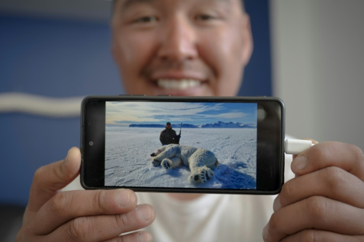 Hunter Martin Madsen shows the last polar bear he killed this year in April before reaching the annual quota