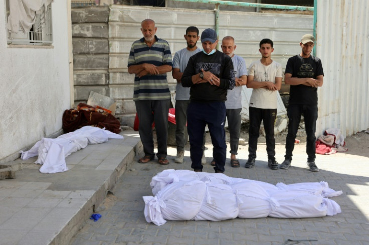 Palestinians pray over the bodies of Gazans killed in an Israeli strike in the Jabalia refugee camp in the northern Gaza