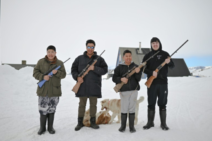 Peter Hammeken (2nd left) and his sons. Hunting is not just a way of life for the Inuit of IIttoqqortoormiit, it is needed for survival