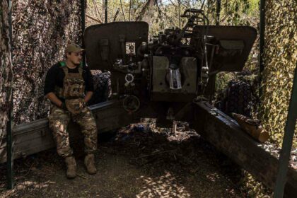 A Ukrainian soldier waits for orders next to the artillery at his fighting position as the Russia-Ukraine war continues in the direction of Liman, Ukraine, on May 25, 2024.