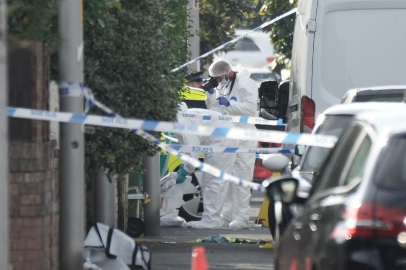 Forensic officers attend the scene of a multiple stabbing attack on July 29, 2024 in Southport, England.