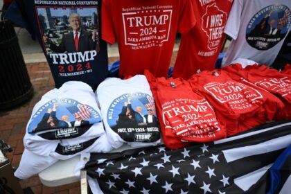 Merchandise supporting former US President and Republican presidential candidate Donald Trump on display during the second day of the 2024 Republican National Convention