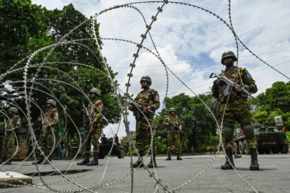 Bangladesh army personnel are manning checkpoints in the capital Dhaka, which is under curfew after days of violence