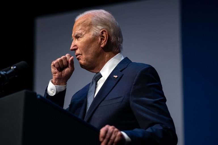 This photo taken on July 16, 2024 shows US President Joe Biden clearing his throat as he speaks on economics during the Vote To Live Properity Summit at the College of Southern Nevada in Las Vegas, Nevada. US President Joe Biden tested positive for Covid