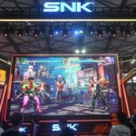 Attendees visit the booth of Japanese video game company SNK at the annual ChinaJoy digital entertainment expo