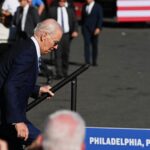 President Joe Biden stumbles while walking on stage