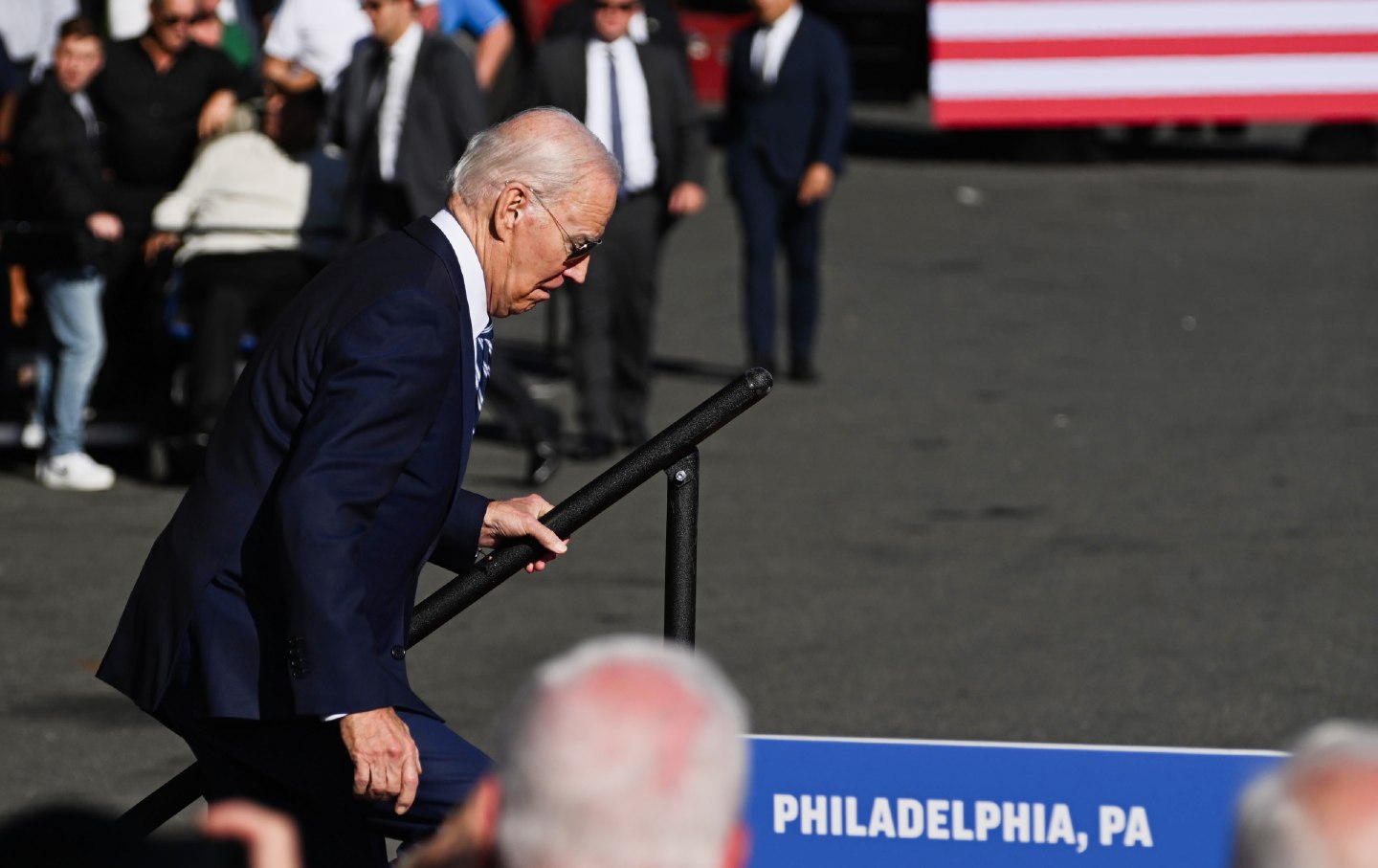 President Joe Biden stumbles while walking on stage