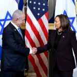 Benjamin Netanyahu and Kamala Harris shake hands during a meeting in the Vice President
