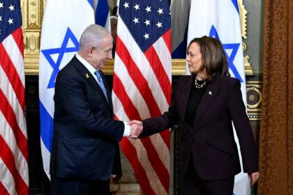 Benjamin Netanyahu and Kamala Harris shake hands during a meeting in the Vice President
