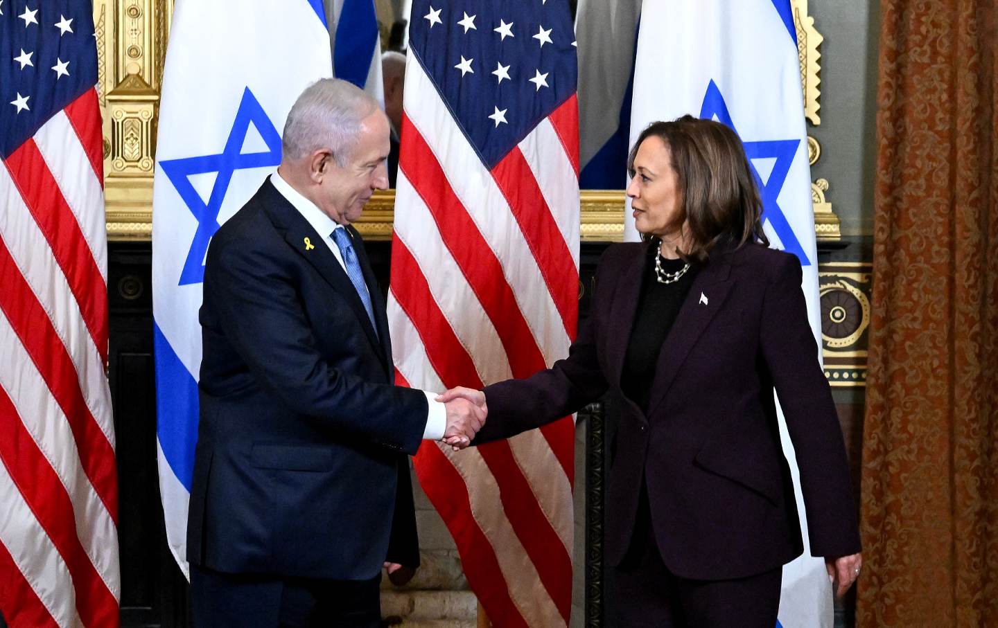 Benjamin Netanyahu and Kamala Harris shake hands during a meeting in the Vice President's Ceremonial Office in Washington, DC, on Thursday, July 25, 2024.
