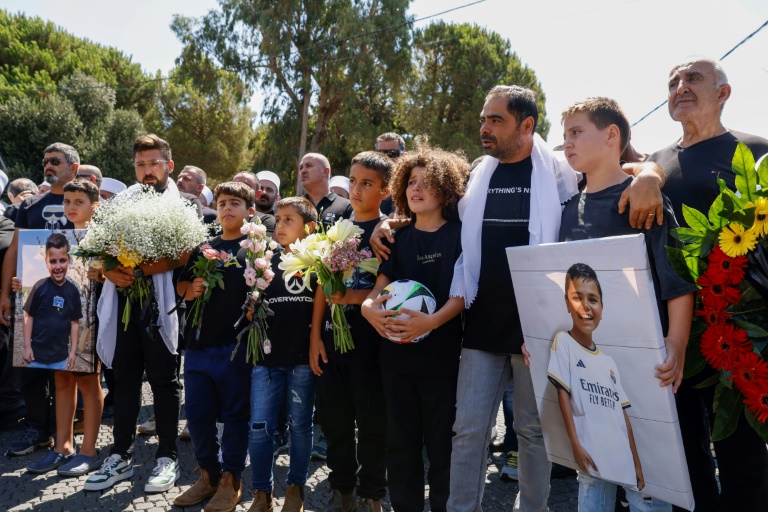 Mourners at the funeral of one of 12 Druze youths killed when a rocket hit a football pitch in the Israeli-annexed Golan Heights