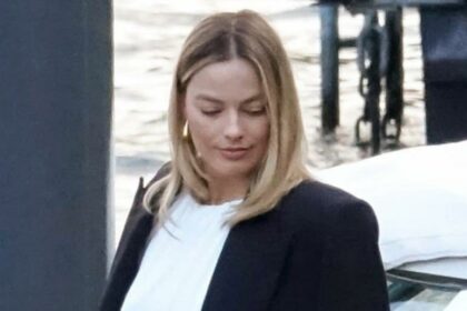 Margot Robbie flashes bare stomach amid news of her reported pregnancy