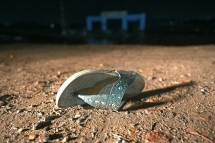 An empty sandal bears witness to a stampede that killed at least 116 people during a Hindu religious gathering in northern India on Tuesday night