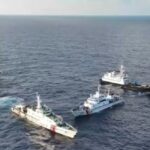 A a frame grab from aerial video footage shows a China Coast Guard ship (2nd L) and vessels identified by the Philippine Coast Guard as 'Chinese Maritime Militia' (L and R) surrounding the Philippine ship BRP Cabra (2nd R)