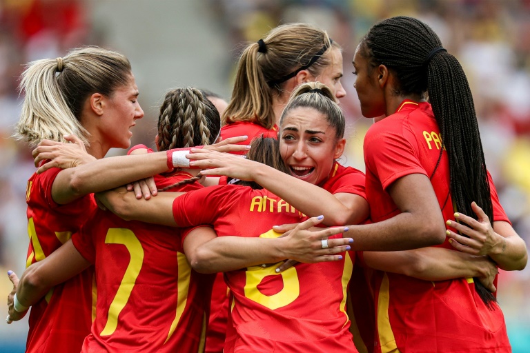 Spain players celebrate after scoring during their 2-1 win over Japan in Nantes on Thursday