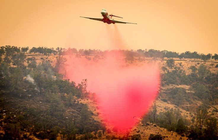 An air tanker drops fire retardant on a ridge as California's Park fire burns on July 27, 2024