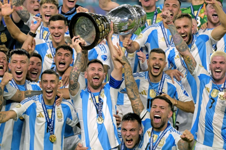 Argentina captain Lionel Messi leads the celebrations after his team's 1-0 Copa America final win over Colombia on Sunday