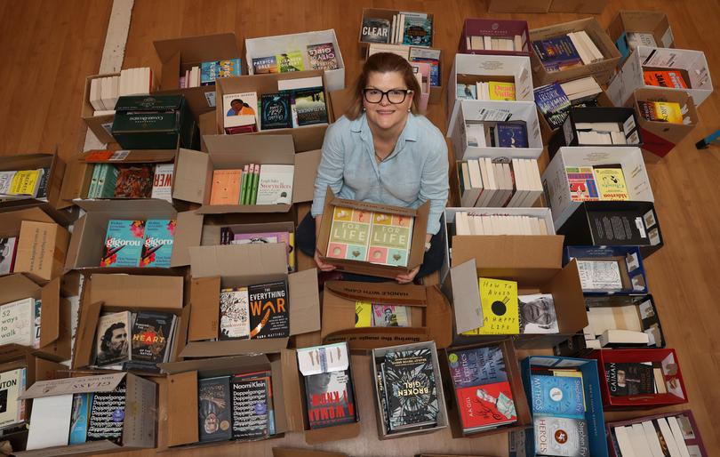 In April last year, Amazon closed its online shop the Book Depository, while this month it was reported online retailer Booktopia went it voluntary administration. Pictured: Jane Seaton, owner, with some of the boxes ready to go