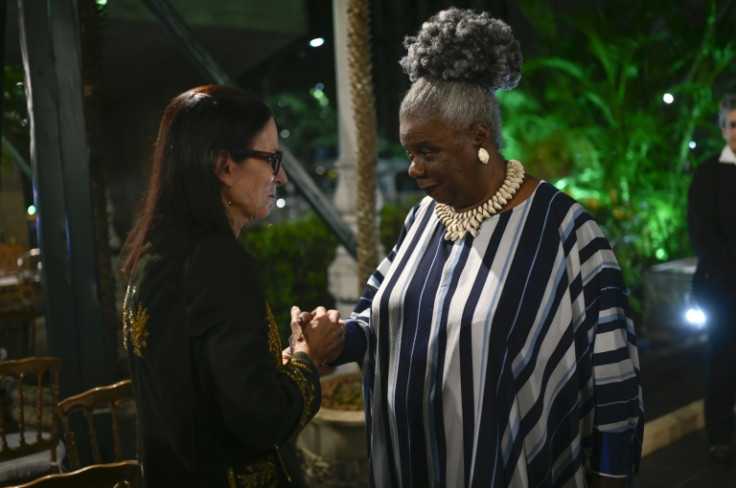 Brazilian historian Lilia Schwarcz greets Brazilian writer Conceicao Evaristo during the former's swearing-in ceremony as an "immortal" member of the Brazilian Academy of Letters in Rio de Janeiro, Brazil
