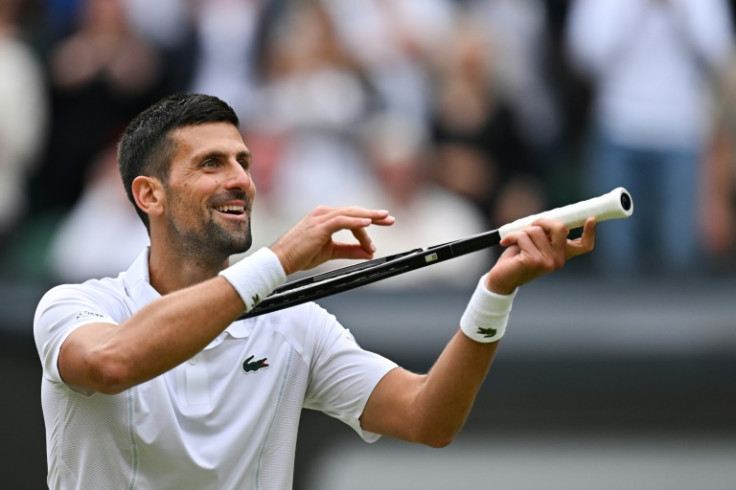 Celebration: Novak Djokovic imitates playing the violin as he celebrates winning against Lorenzo Musetti