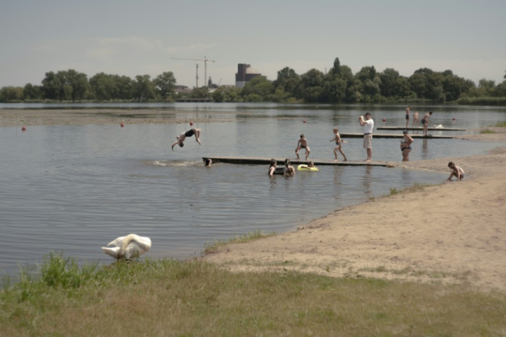 Despite the danger, locals still go outside to swim in the river or relax in the shade